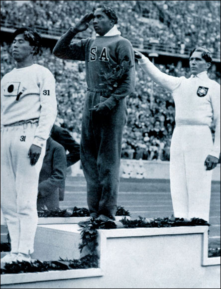  The men's long jump medal ceremony. Jesse Owens, centre, salutes the flag after winning gold, with left, Naoto Tajima, Japan (silver) and right, Wilhelm Leichum, Germany, (bronze) giving the Nazi salute.