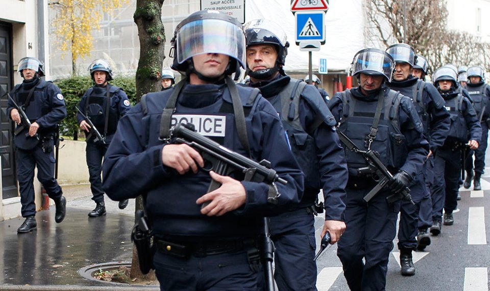 French intervention police take up position near the scene of a hostage taking at a kosher supermarket in eastern Paris January 9, 2015