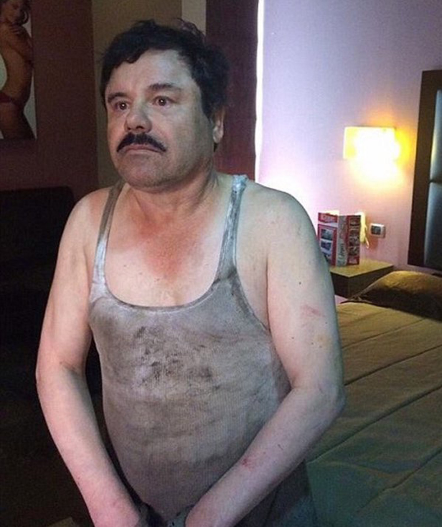 Foiled again ... drug lord Joaquin 'El Chapo' Guzman Loera back in cuffs