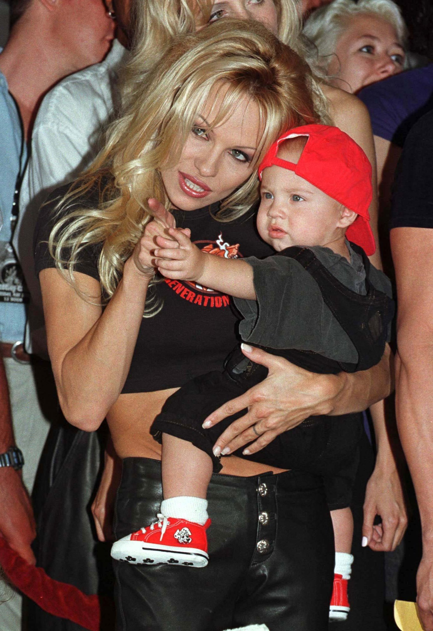 WAS01:ENTERTAINMENT-LEE:¿LOS ANGELES,29DEC97- FILE PHOTO 20MAY97 - Former Baywatch star Pamela Anderson Lee, shown with her first son Brandon at the Rockwalk in Hollywood in this May 20, 1997 file photo, gave birth to her second son December 29, her publicist said. Dylan Jagger Lee was born at 11:20 a.m. PST at the actress' home in Malibu and weighed 6 pounds, 14 ounces. sv/Photo by Fred Prouser REUTERS