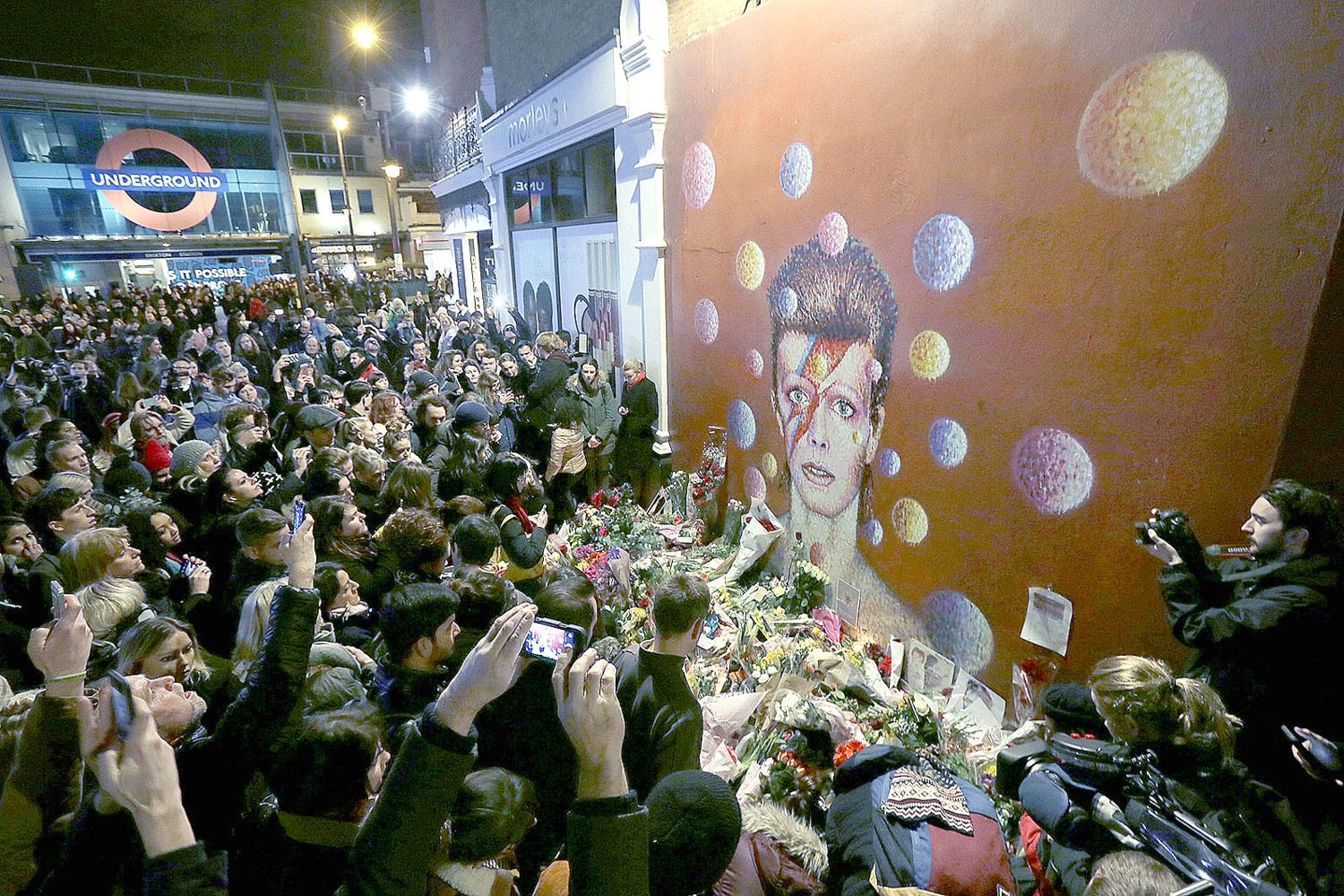 An idol remembered ... crowds at Bowie mural in Brixton