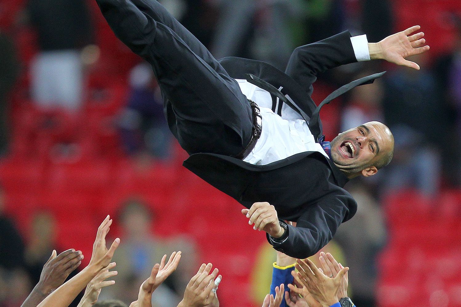 Pep Guardiola is thrown into the air following Bayern Munich's Champions League final victory