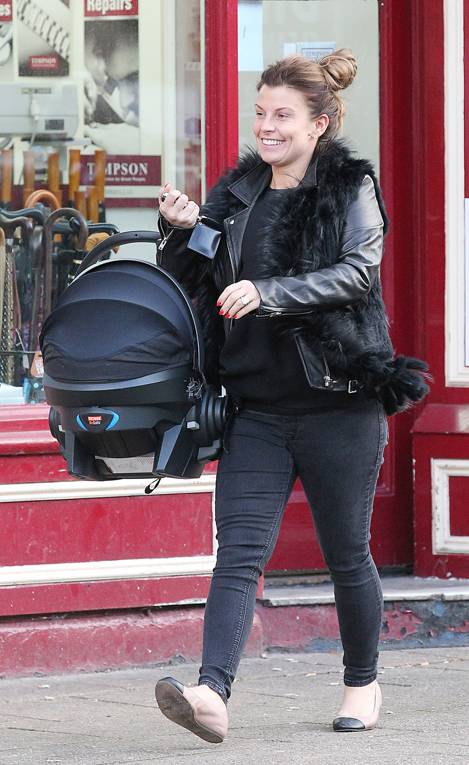 9.2.16....Coleen Rooney takes new son Kit for his first shopping trip into Alderley edge, Cheshire on Tuesday afternoon.