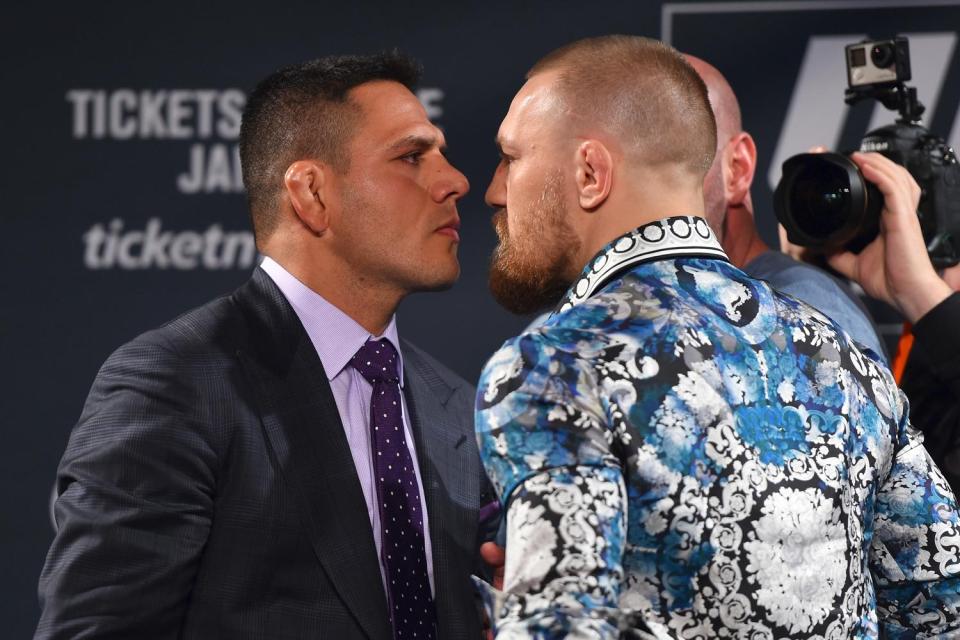 What might have been: Rafael dos Anjos and Conor McGregor were due to fight for the UFC lightweight title at UFC 196, but injury ruled out the Brazilian champion