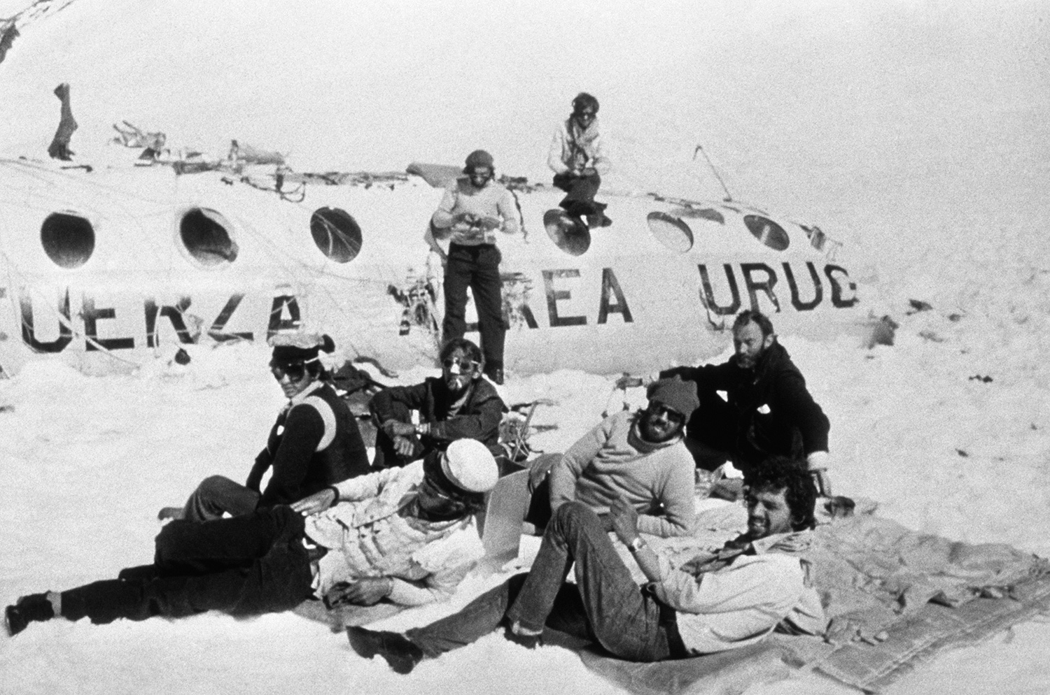 MENDOZA, ARGENTINA - DECEMBER 1972: (FILE) Members of Old Christians Rugby team pose for a picture in the plane's tail on December, 1972 in Mendoza, Argentina. On October 13th of 1972 a plane carrying the Uruguayan rugby team Old Christians to Santiago de Chile crashed in the Andes. 29 people died, including players and relatives, and only 16 survived under the most extreme conditions: hunger, temperatures up to 30 degrees below zero and isolation. Eleven days after the accident, they heard in the radio that the search had been stopped and they were presumed dead. Determined not to let themselves die, on December 12th, Nando Parrado, Roberto Canessa and Antonio Vizintín decided to leave the plane and find some help. They walked ten days and 55 kilometers to the west in the snow until mule driver Sergio Catalan found them on a riverside. On December 23th and after 72 days of isolation in the mountains, the survivors were rescued by the Air Rescue Service. This story was taken to the cinemas when in 1993 the movie ¿Alive¿ was presented. Nowdays the survivors give lectures on survival and leadership, telling their story and sharing their experience worldwide.