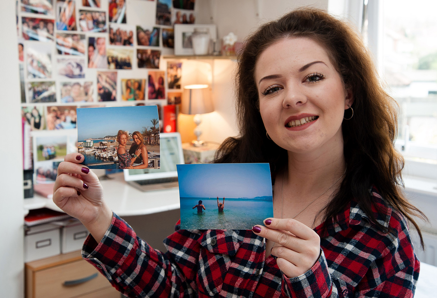 Laura Rose packing up clothes to go to the post office) - This is the savvy student who splashes the cash on jetset holidays - after making a whopping 30,0000 selling her old clothes on ebay.