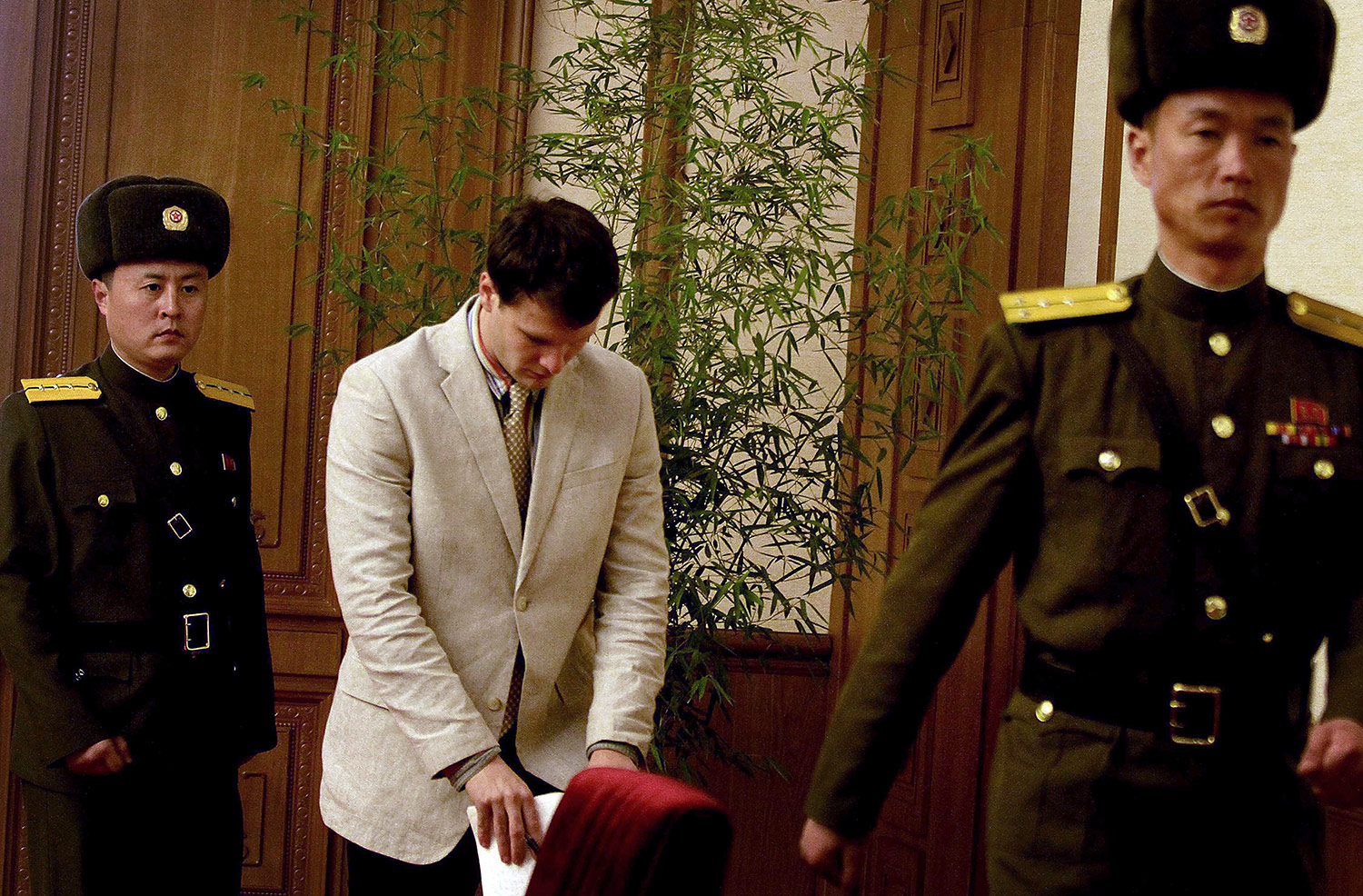 American student Otto Warmbier, right, is presented to the reporters on Monday, Feb. 29, 2016, in Pyongyang, North Korea