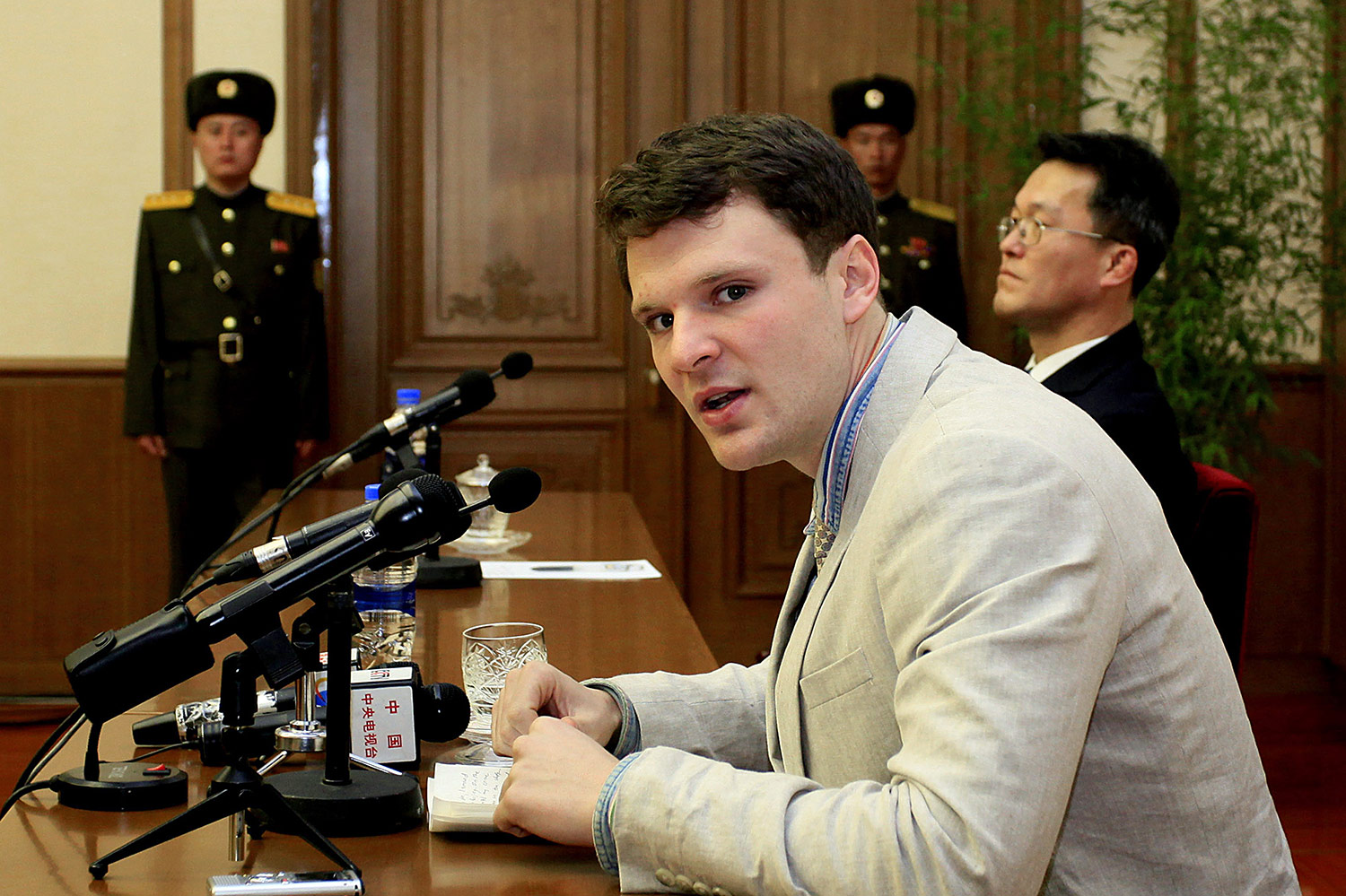 American student Otto Warmbier, right, is presented to the reporters on Monday, Feb. 29, 2016, in Pyongyang, North Korea