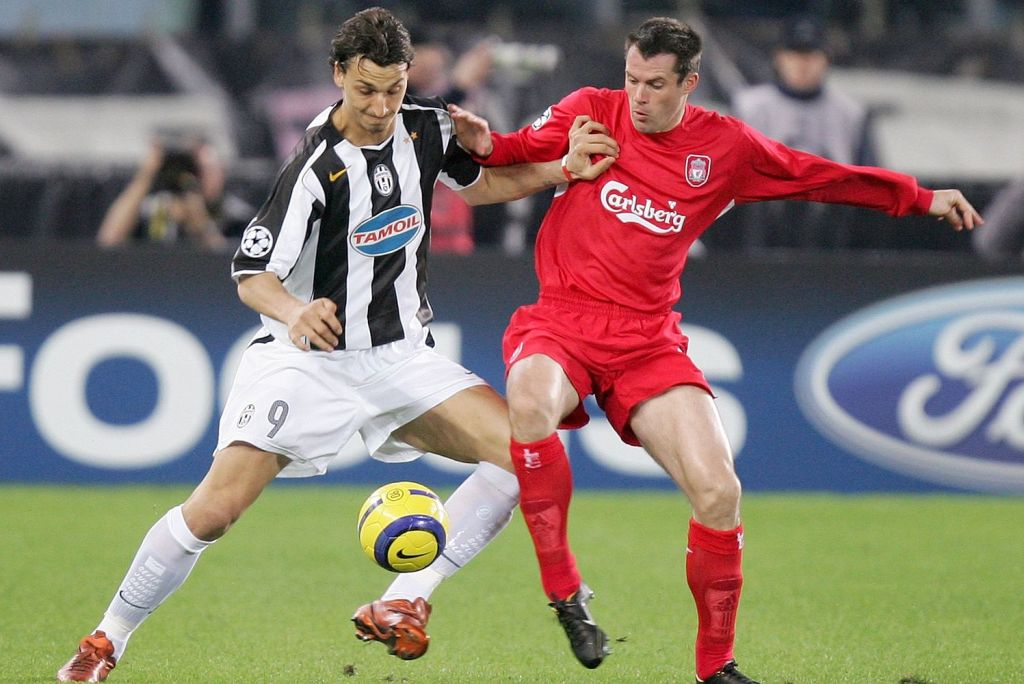  Zlatan Ibrahimovic tussles with Jamie Carragher as Liverpool and Juventus played out a 0-0 draw in their Turin clash