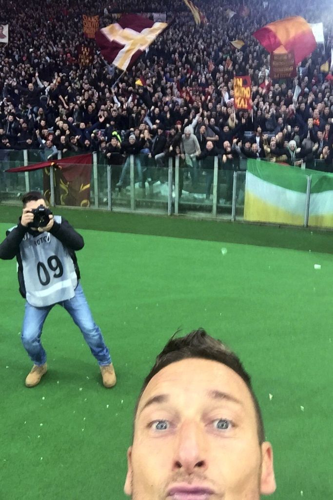 Francesco Totti shows he's in touch with modern football as he celebrates a goal against Lazio with a selfie 