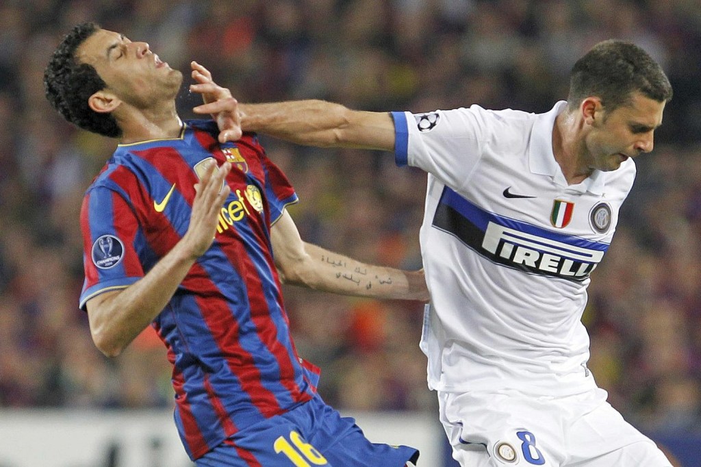  Sergio Busquets reacts to feeling contact from Thiago Motta, and the Inter man sees red but Inter still go through