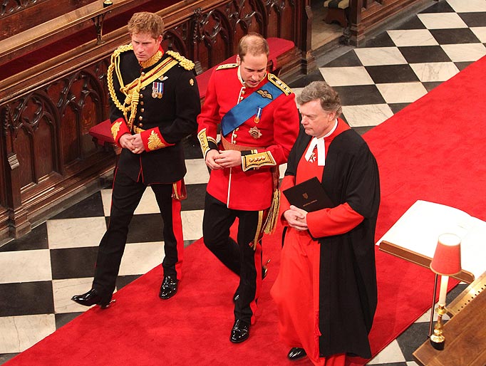 Prince William (centre) and his best man Prince Harry (left) are greeted by Receiver General Stephen Lamport (right) as they arrive inside Westminster Abbey