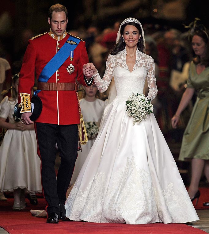 Britain's Prince William and his wife Kate, Duchess of Cambridge stand outside of Westminster Abbey after their Royal Wedding in London Friday, April, 29, 2011.