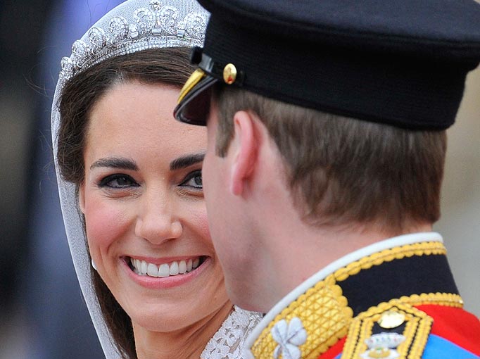 Britain's Prince William and Catherine, Duchess of Cambridge, look at each other as they leave the Westminster Abbey after their wedding ceremony in central London April 29, 2011.