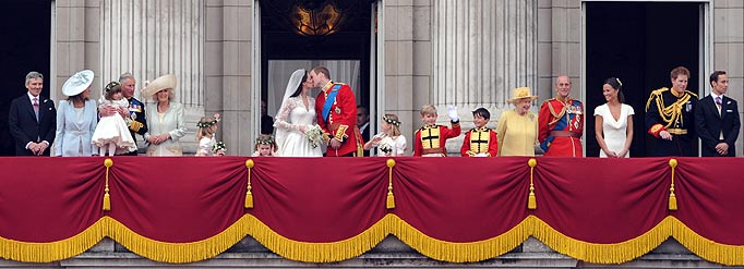 Britain's Prince William kisses his wife Kate, Duchess of Cambridge, on the balcony of Buckingham Palace, after the wedding service, in London, on April 29, 2011.