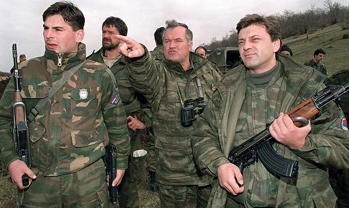 This is an April 16, 1994 photo of top war crimes fugitive Bosnian Serb army commander General Ratko Mladic, center, in Gorazde, eastern Bosnia, surrounded by his bodyguards.