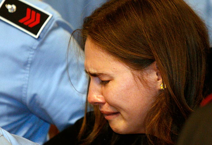 Amanda Knox breaks in tears as she is taken away after hearing the verdict that overturns her conviction and acquits her of murdering her British roommate Meredith Kercher, at the Perugia court, c