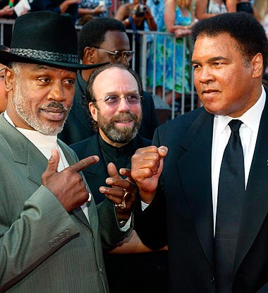 Boxers Joe Frazier (L) and Muhammad Ali pose together as they arrive at the 10th annual ESPY Awards which honor excellence in all sports in Hollywood in this July 10, 2002 file photo.