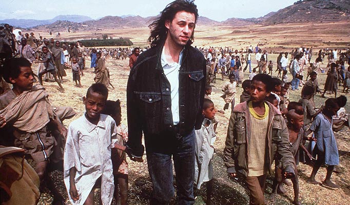 BOB GELDOF WALKING WITH CHILDREN