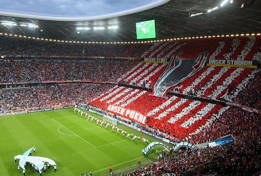 MAKING A STAND ... Bayern fans hold up signs saying 'Our City, Our Stadium, Our Cup'