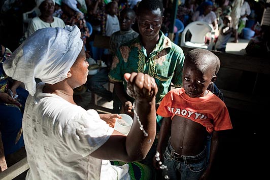 A boy accused of being "child witch" is exorcised in a church in Kinshasa on November 10, 2010. Thousands new fundamentalist Christian sects in Kinshasa make money out of identifying 'witches'.