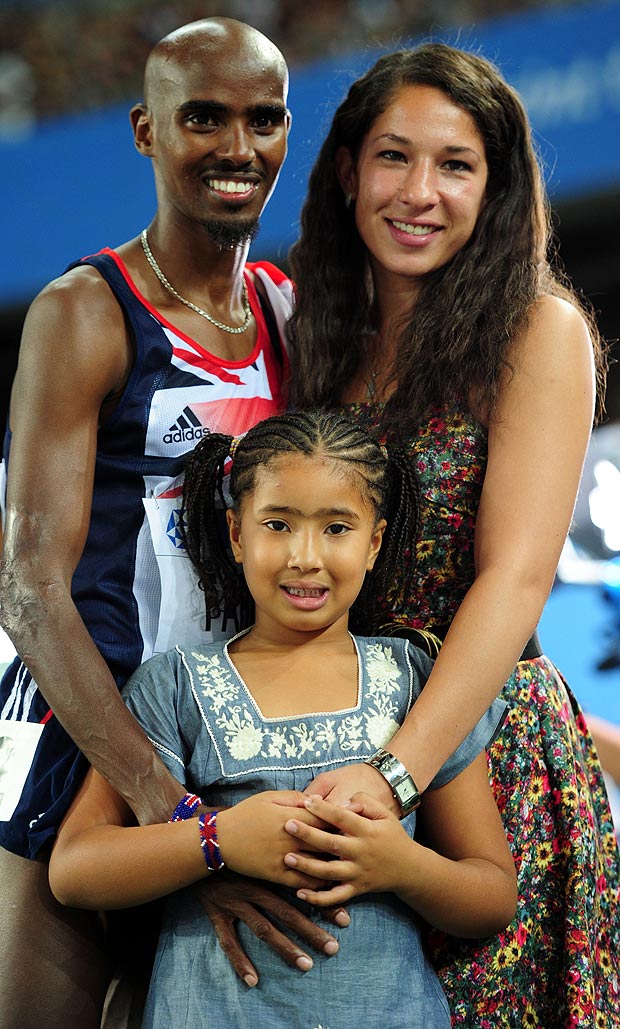 Great Britain's Mo Farah celebrates winning the Men's 5000m with his wife Tania and daughter Rihanna