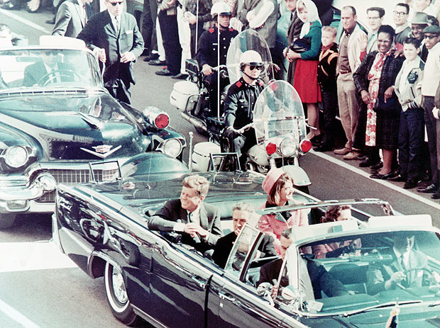 John F Kennedy and his wife Jacqueline are all smiles as they greet the Dallas masses, moments before tragedy