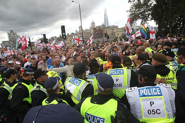 The English Defence League (EDL) march near Tower Bridge in London despite losing a High Court battle over where they are allowed to demonstrate.