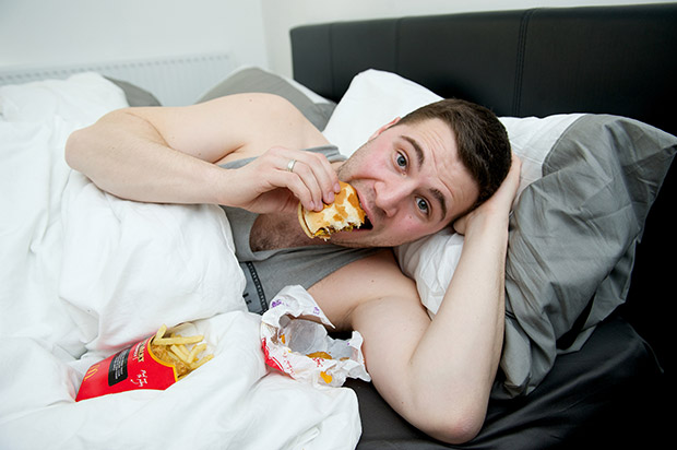 Lee Price eating only McDonalds for one week to mark the tenth anniversary of Supersize Me - 14th April 2014 This picture: In bed with his dinner