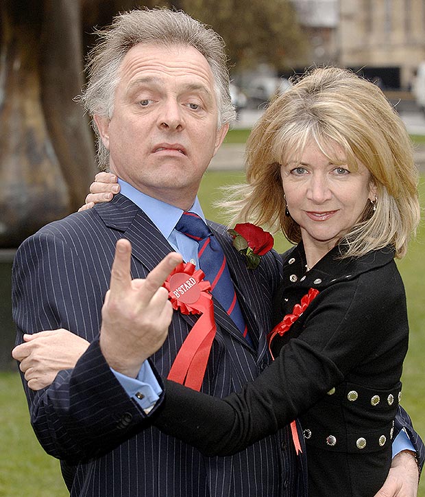 Rik Mayall as Alan B'Stard and actress Marsha Fitzalan