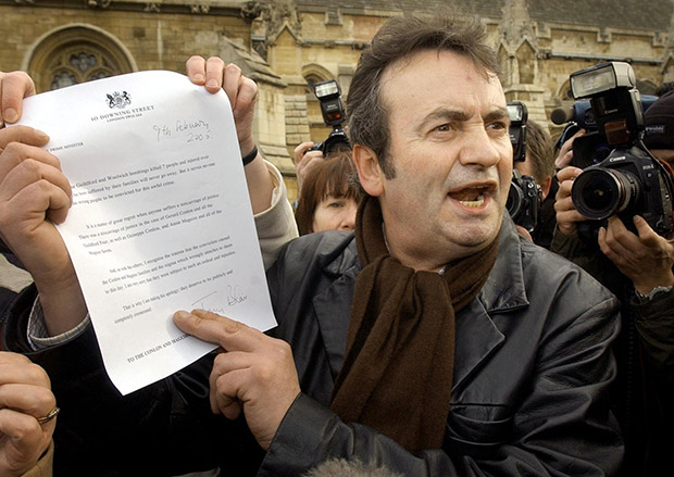 Gerry Conlon outside the House of Commons showing the media the letter of apology he received from Prime Minister Tony Blair