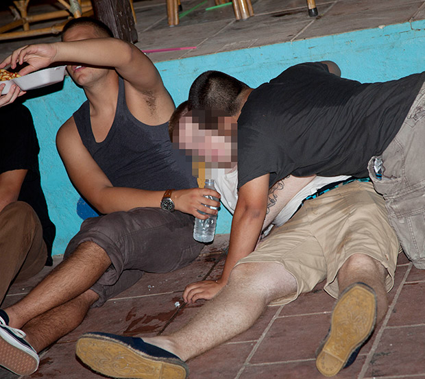 One man in a drunken mess is helped by his friends in Malia