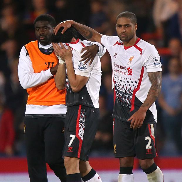 Glen Johnson helps console Luis Suarez after Liverpool's infamous draw with Crystal Palace