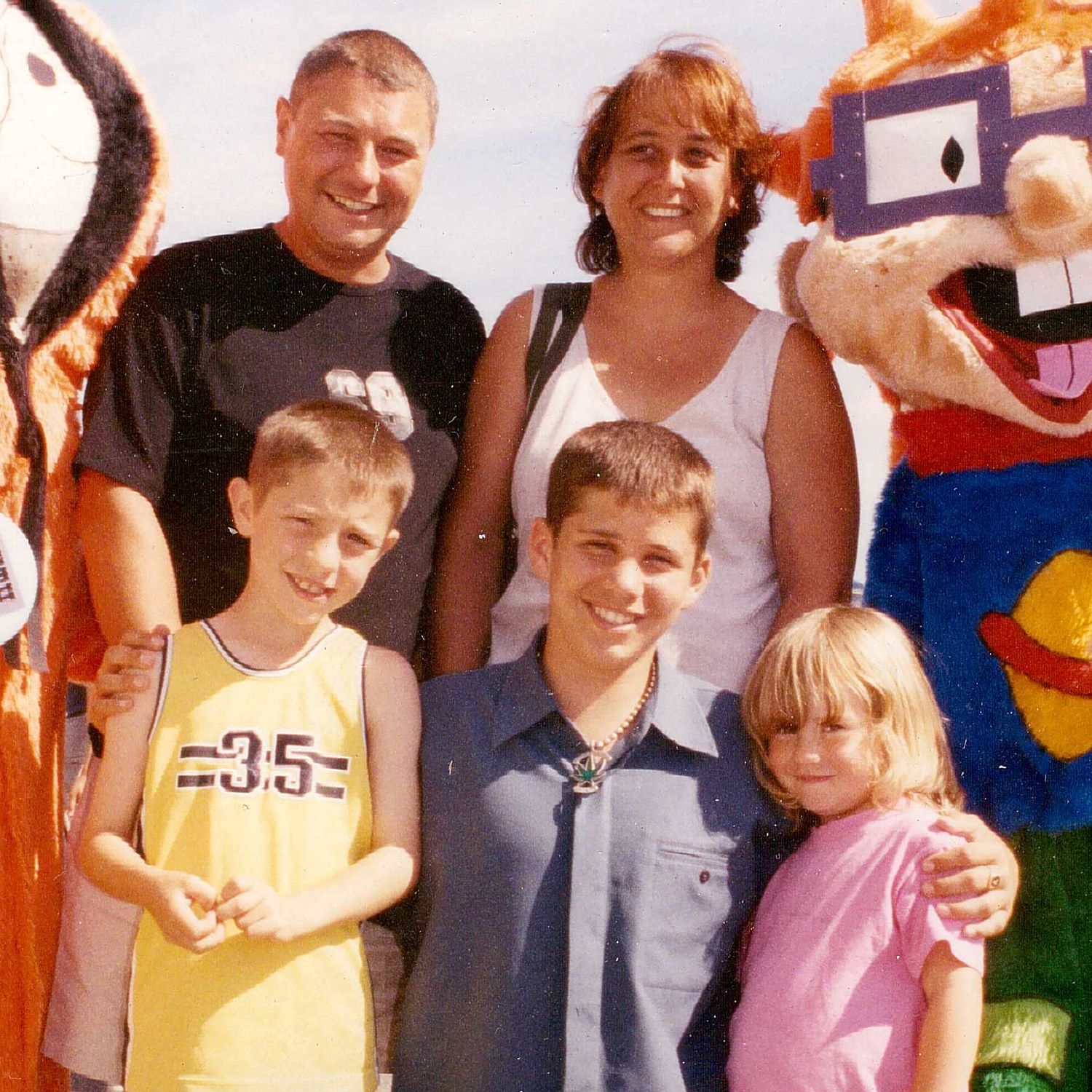 Matthews,  centre, hugs Becky in family snap