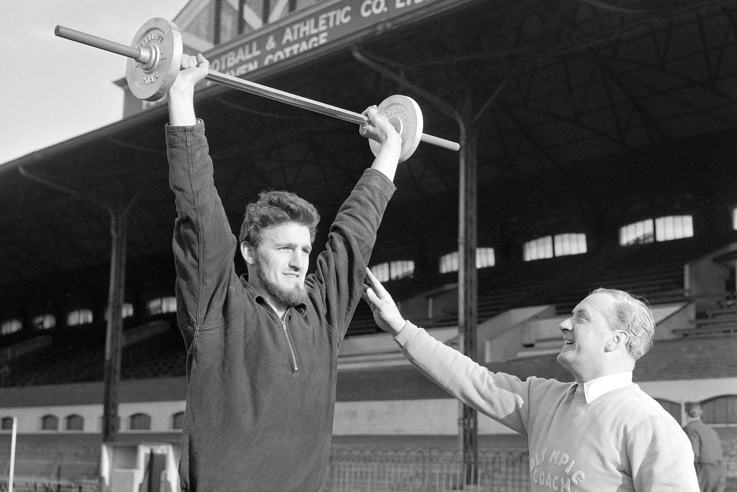 Jimmy Hill shows off his strength in training