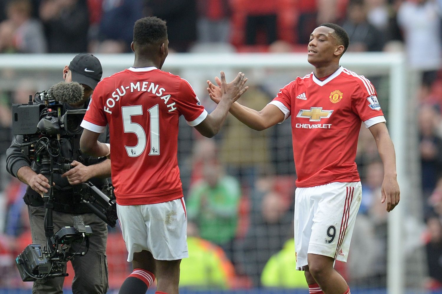 Playing the field ... Man Utd star Timothy Fosu-Mensah, pictured above with team-mate Anthony Martial, begged a busty model for a threesome