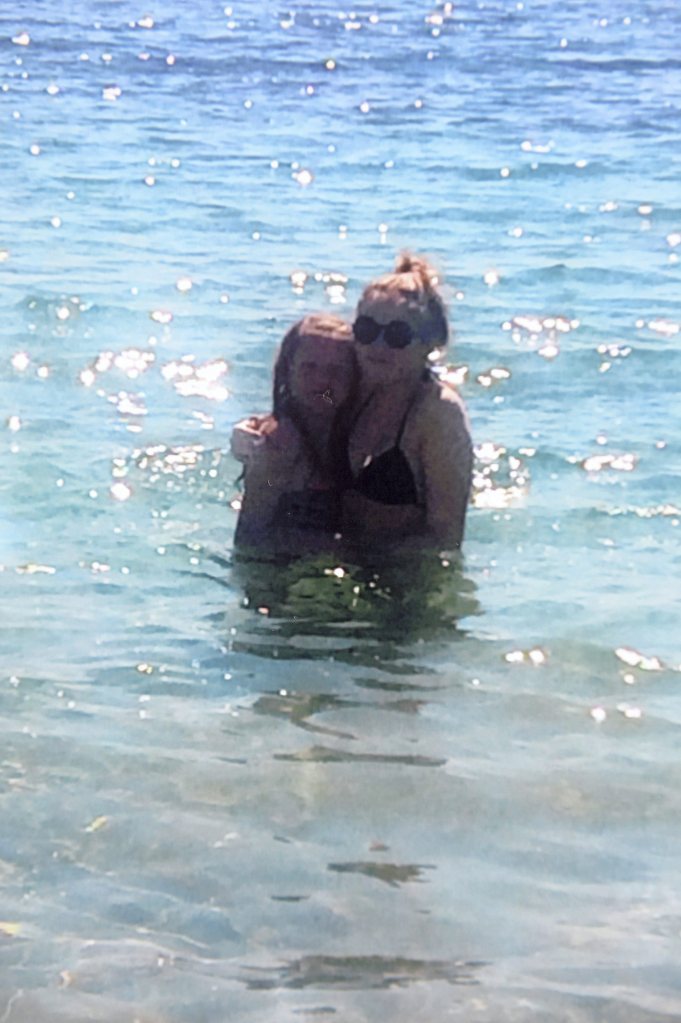 Amelie and her 14-year-old sister Courtney frolic in the crystal blue waters off the coast of Ibiza during their holiday they jetted off for last month