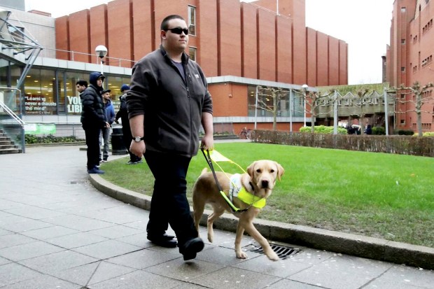 22-year-old student Charles Bloch has been blind with cataracts since birth and relies on his two-year-old labrador Carlo to get around