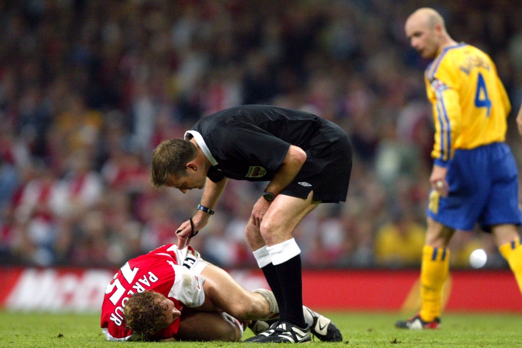  Ray Parlour lies injured during the 2003 FA Cup final, which helped net fortunes for punters