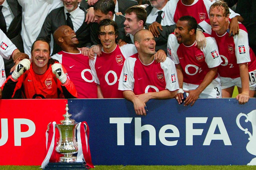  Arsenal celebrate their FA Cup win - and Parlour's injury stung the bookies