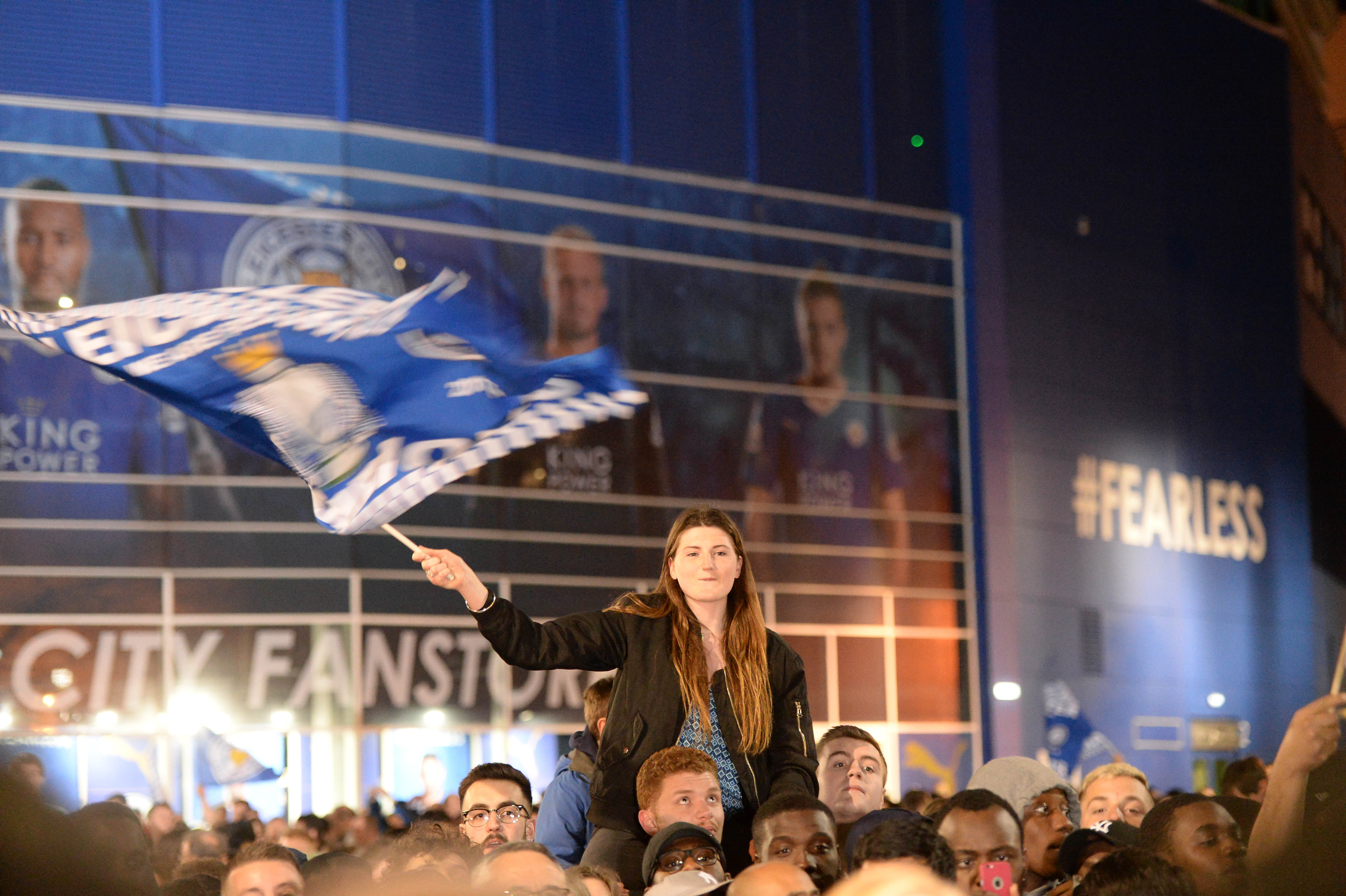 Leicester supporters gathered outside the King Power Stadium to party last night