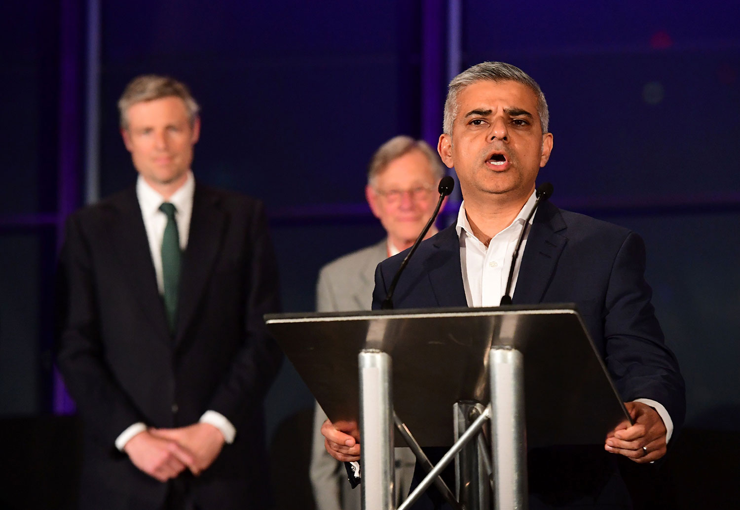 Newly elected London Mayor Sadiq Khan (Foreground) addresses the media following his election victory at City Hall in central London on May 7, 2016. London