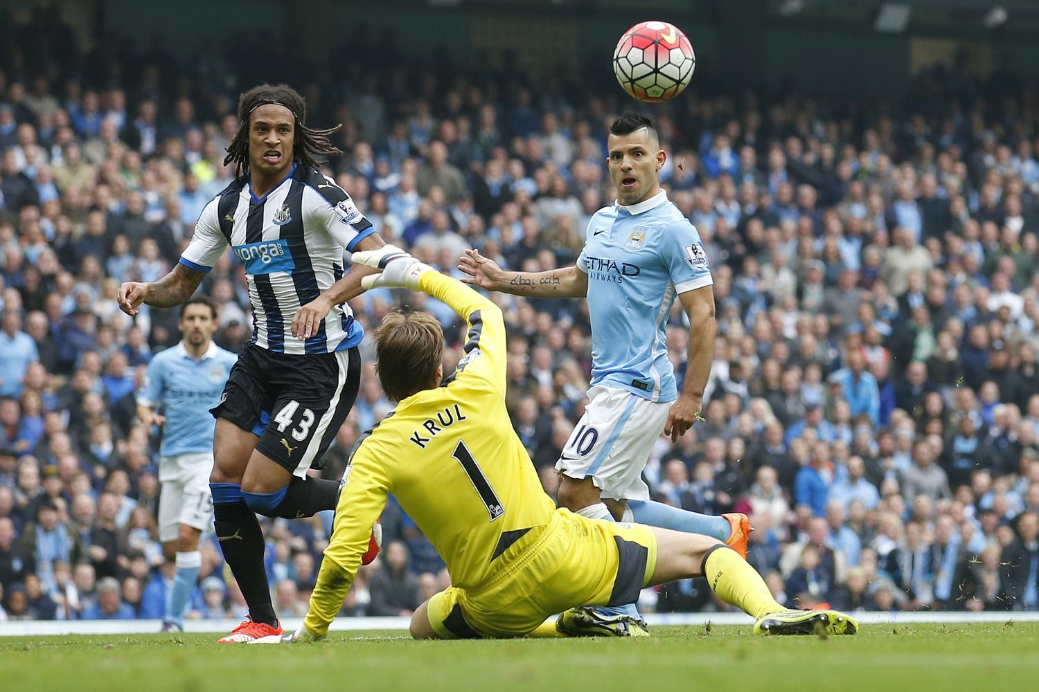 Sergio Aguero scores past Tim Krul in the 6-1 defeat for Toon at the Etihad