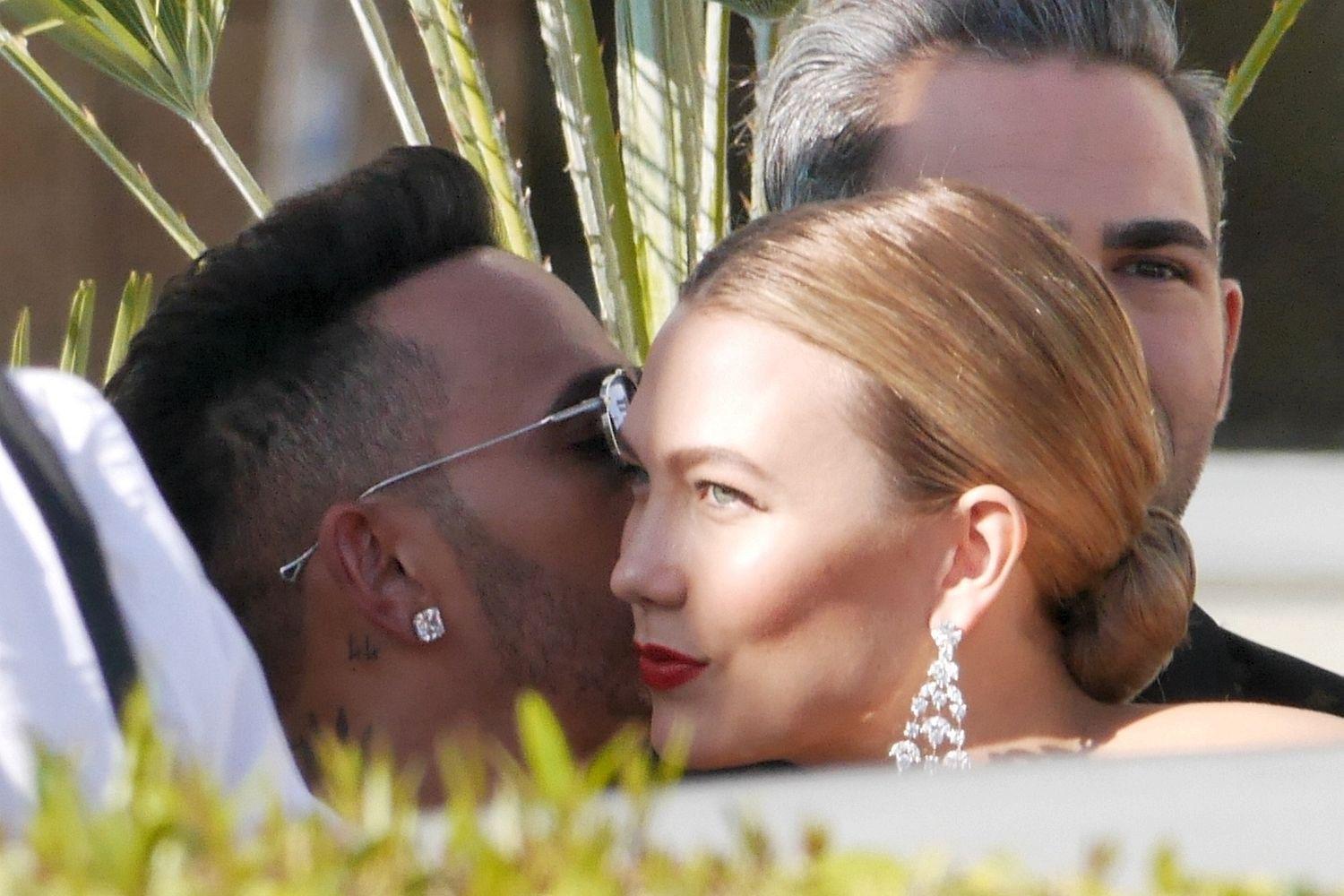 Up Kloss and personal ... Lewis Hamilton and model Karlie share a kiss