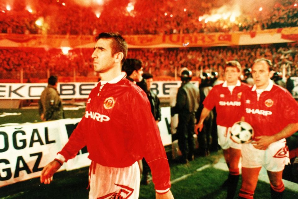 Eric Cantona confidently walks out in front of a hostile Galatasaray crowd in the Champions League