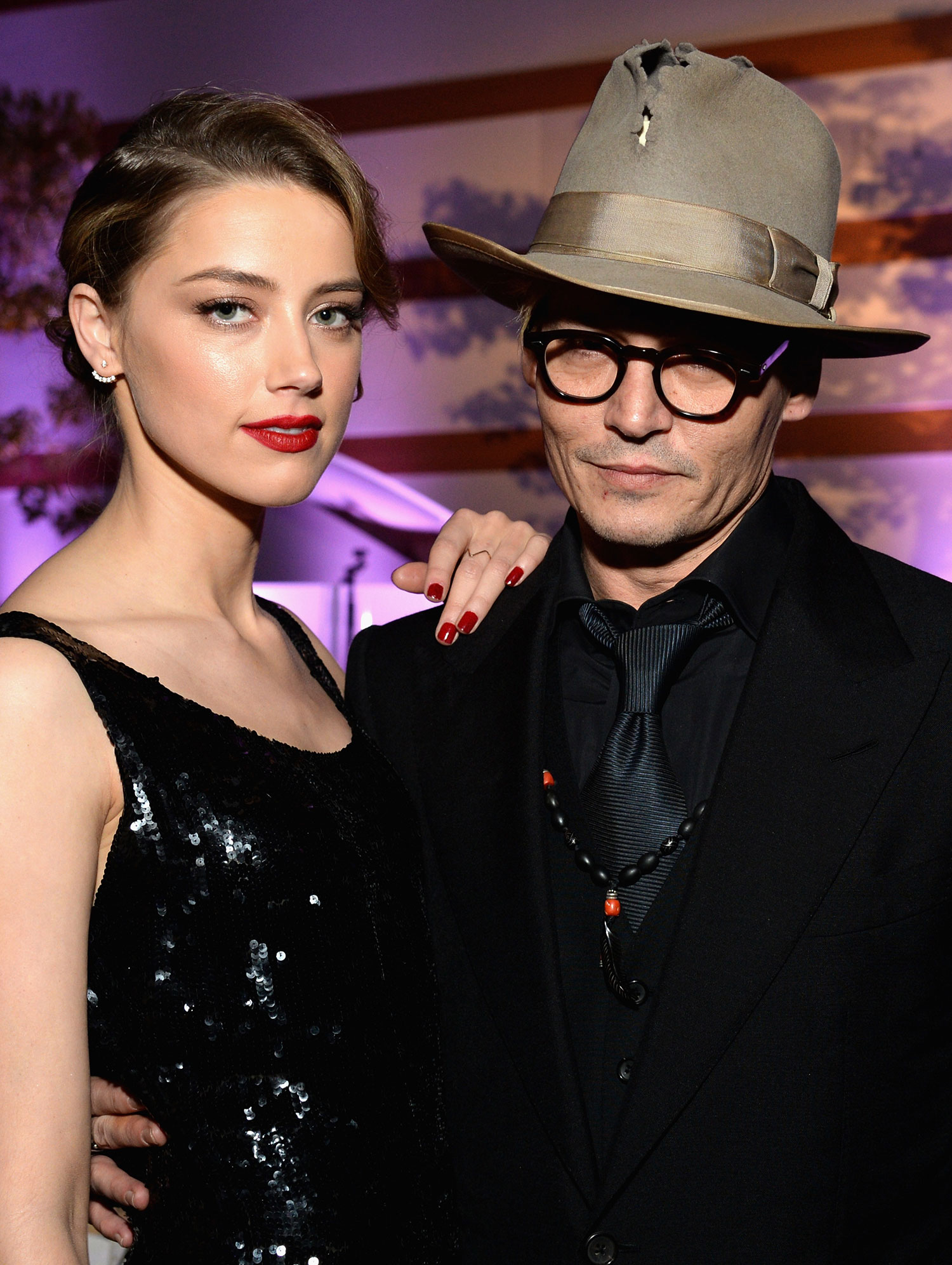 Actors Amber Heard (L) and Johnny Depp