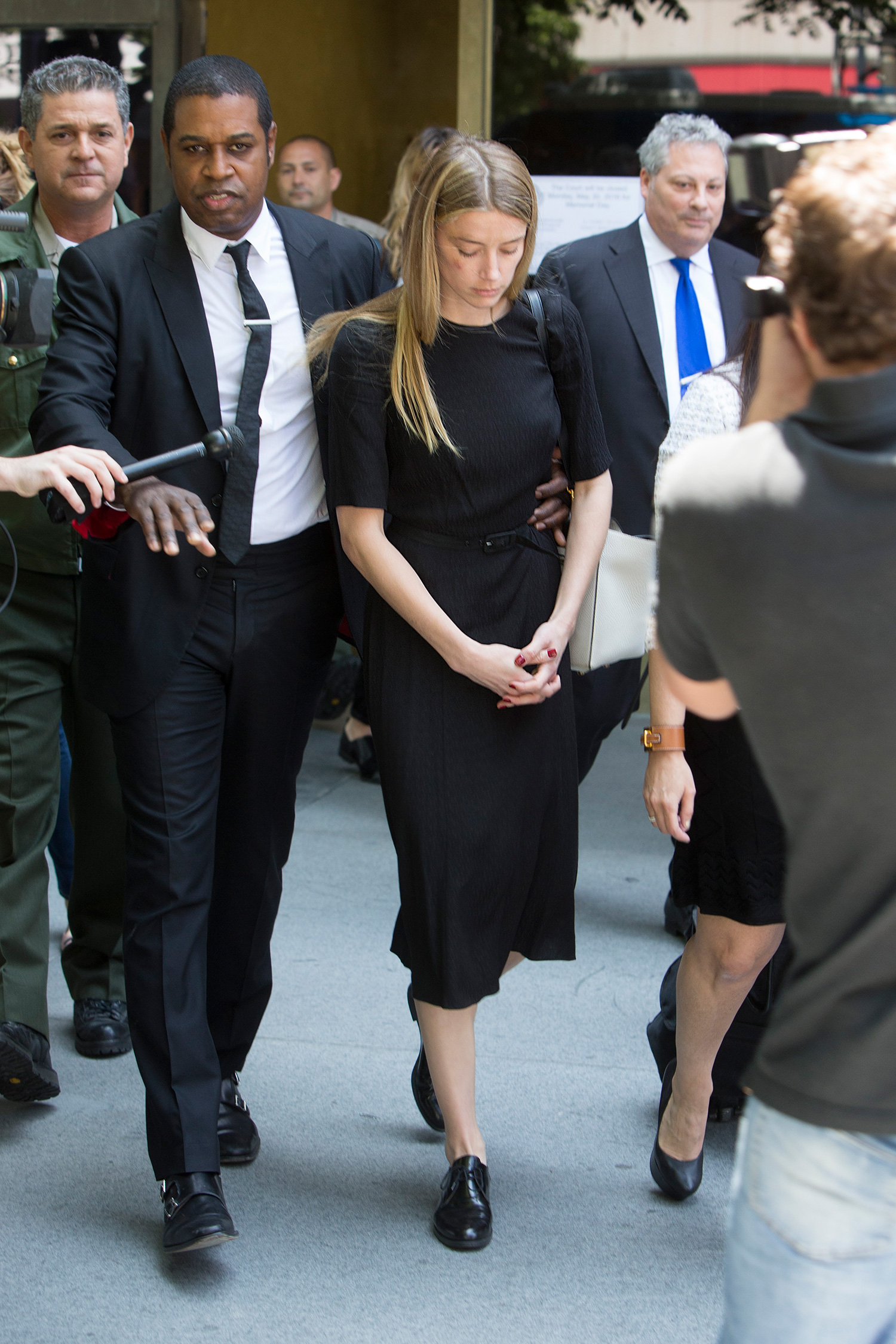 Amber Heard leaves court in Downtown Los Angeles,CA. Amber Heard has been granted a temporary restraining order after accusing her estranged husband Johnny Depp of domestic abuse in a court filing. Amber had obvious bruises on her face and was visibly shaken by the ordeal. Pictured: Amber Heard Ref: SPL1287558 270516 Picture by: Splash News Splash News and Pictures Los Angeles: 310-821-2666 New York: 212-619-2666 London: 870-934-2666 photodesk@splashnews.com¿