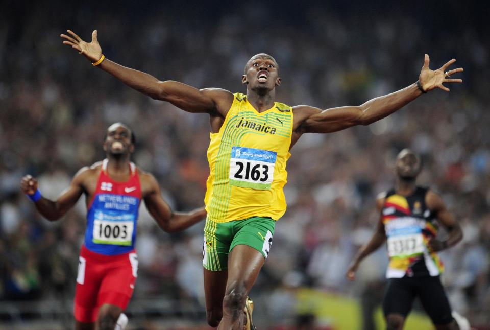 Usain Bolt celebrates winning gold at the Beijing Olympic Games in 2008