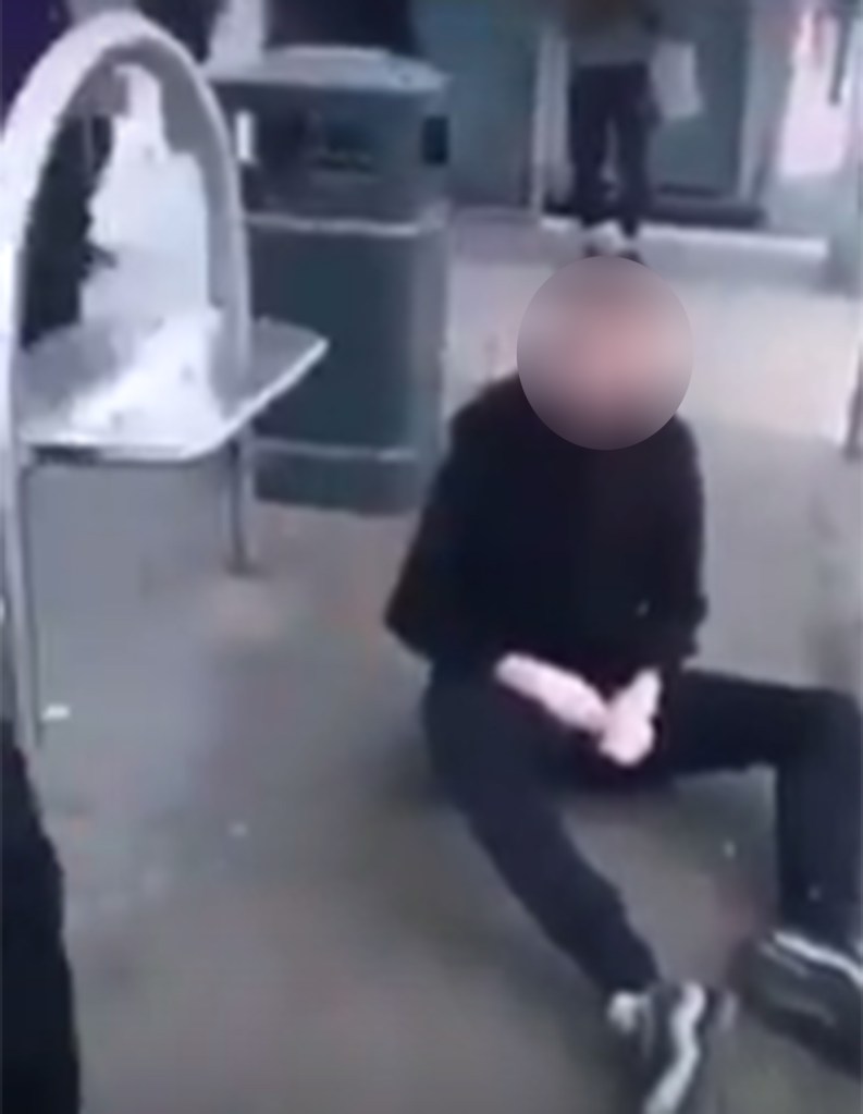  The victim ends up sat on the floor after the youth he was fighting's pals joined in