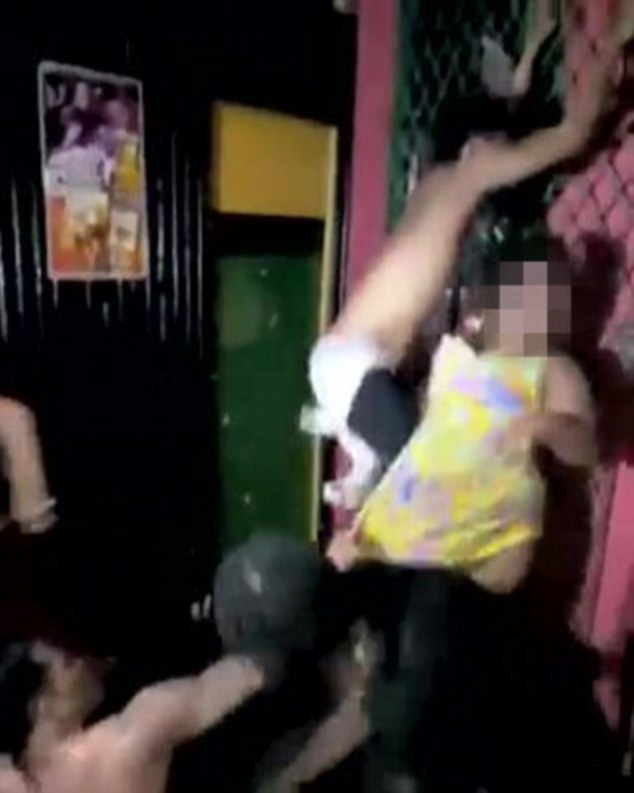  The three men turn their attentions towards the victim in the club in Montego Bay, Jamaica